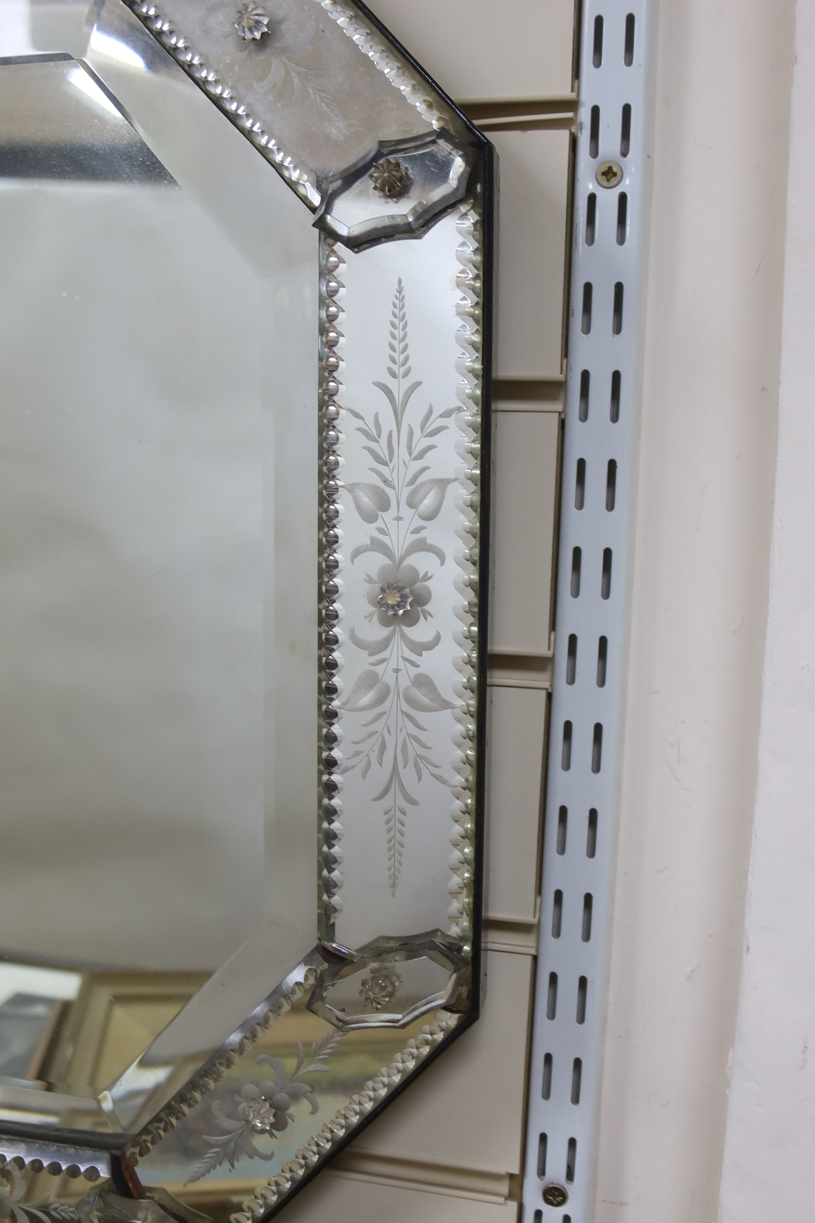 A 19th century Venetian glass mirror, 40 cms wide x 61 cms high.